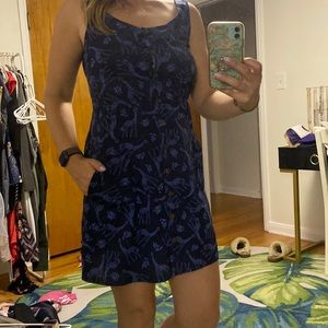 Strapped dress with button down front and cross buttoned open back.